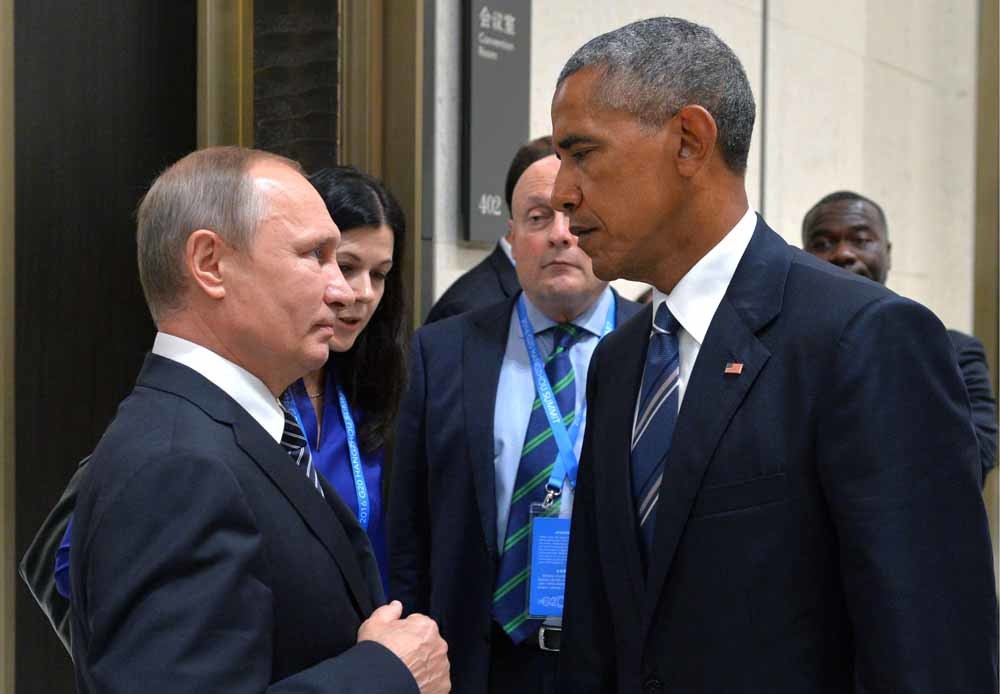 De Russische president Vladimir Poetin en zijn voormalige ambtgenoot Barack Obama tijdens de G20-top in Hangzhou, China vorig jaar. – © Alexei Druzhinin / Getty