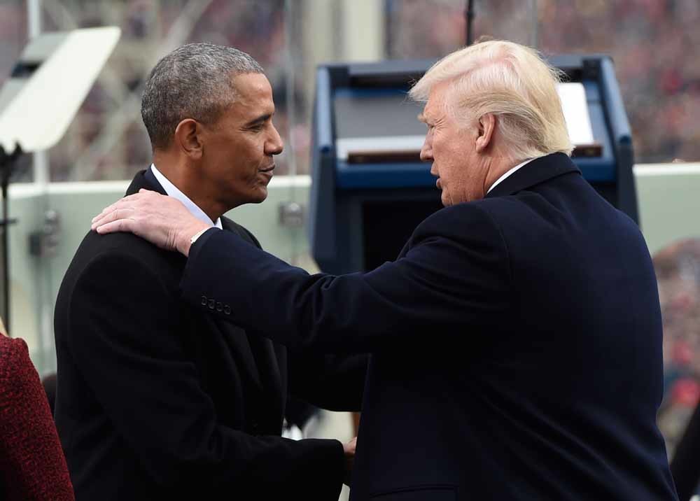 Obama en Trump oog in oog bij de inauguratie van Trump in januari dit jaar. – © Saul Loeb / HH