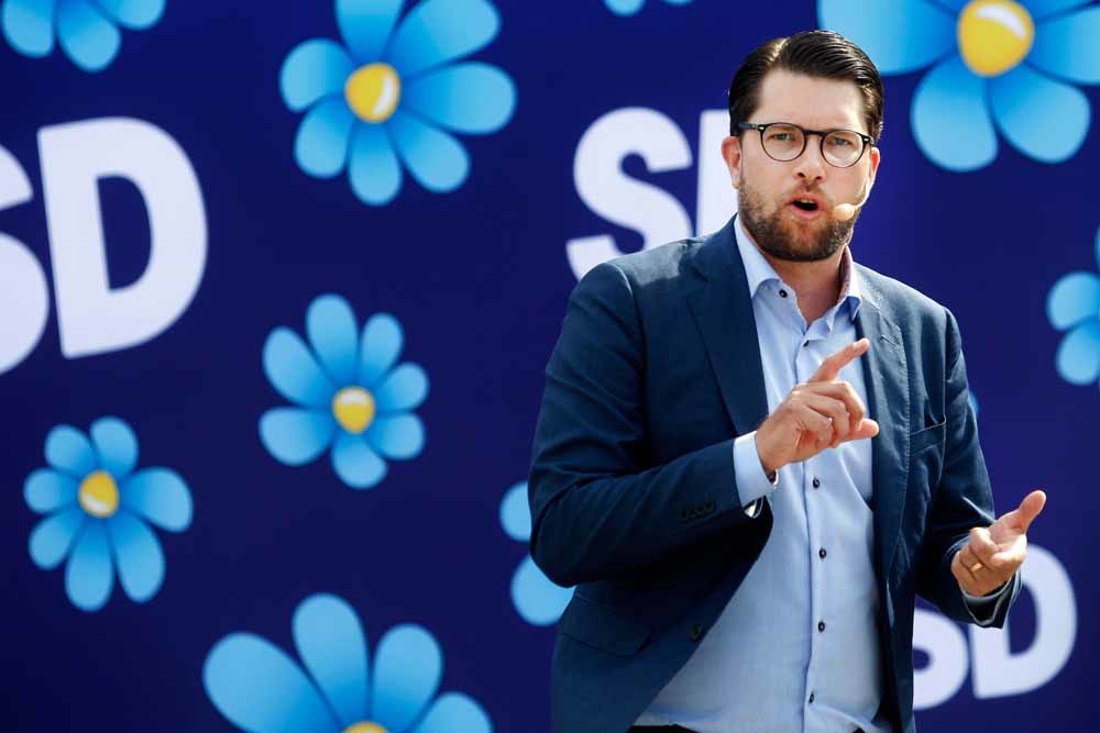 Jimmie Akesson, de leider van de Zweden-Democraten, op campagne in augustus. – © Mats Andersson / HH