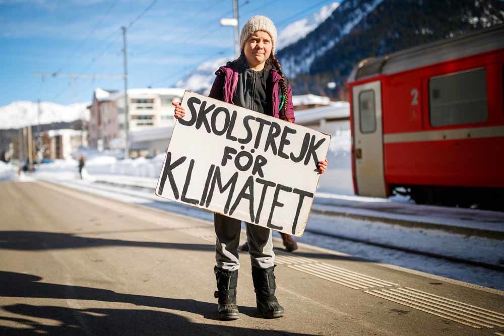 Greta Thunberg (16) arriveert in Davos voor de jaarlijkse meeting van het World Economic Forum, 23 januari 2019. –  © Valentin Flauraud/Keystone via AP