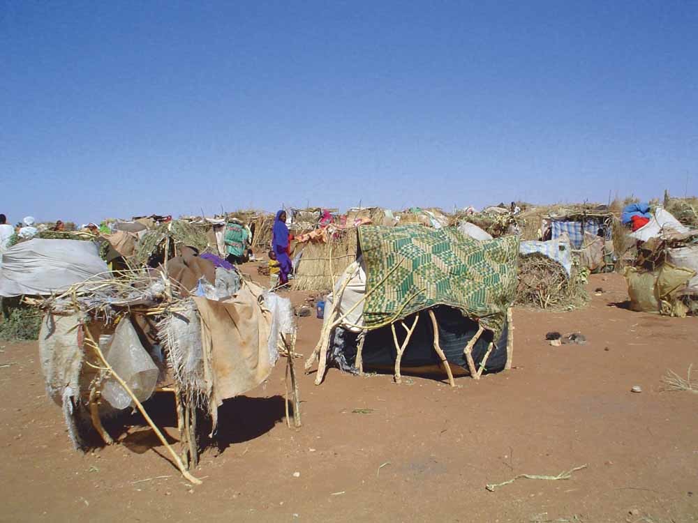 Vluchtelingenkamp in Zuid-Darfur. Volgens Elbasri trad de VN niet op tegen het systematische geweld van Soedanese regeringstroepen. – © USAID