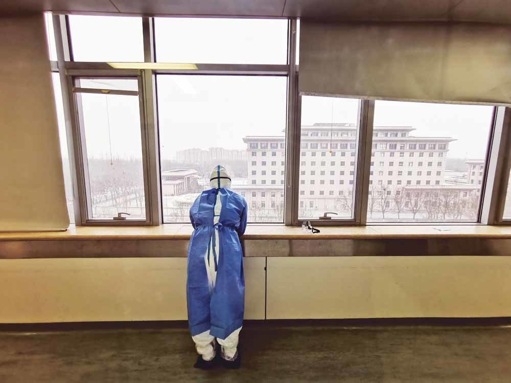 wuhan wuhan worker at window still1
