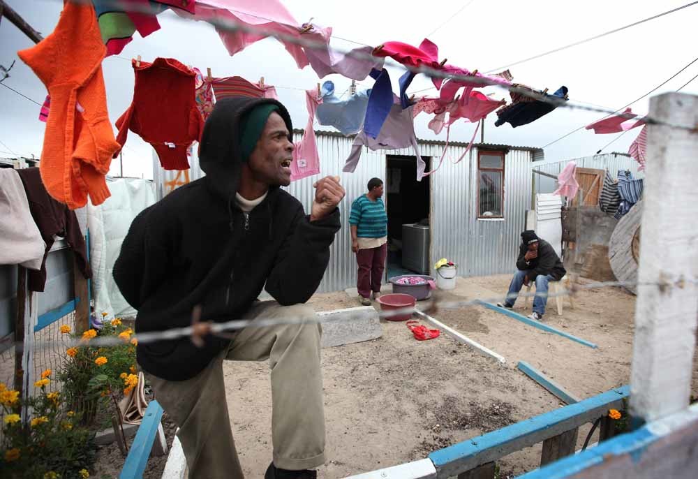 Bewoners van Blikkiesdorp ten tijde van het WK Voetbal in 2010. – © Dan Kitwood / Getty Images