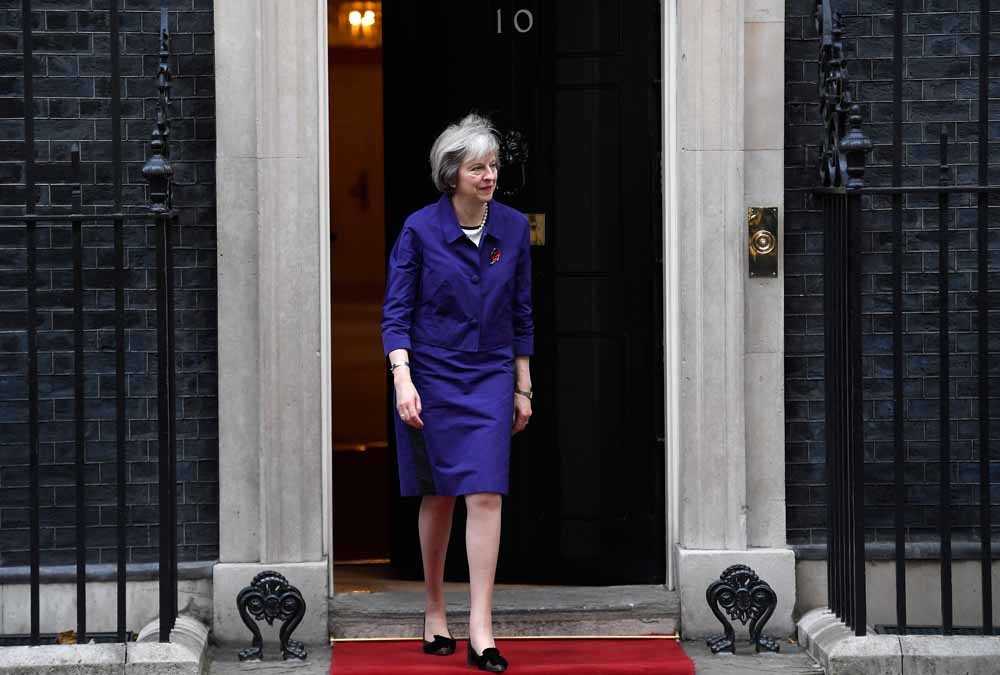 De Britse premier Theresa May kan op goede wil uit Washington rekenen. – © Reuters