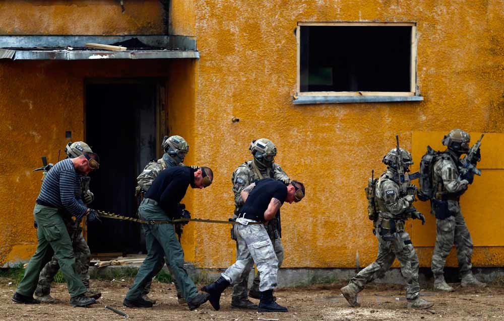 Poolse soldaten bij een NAVO-oefening in Polen. – © Reuters